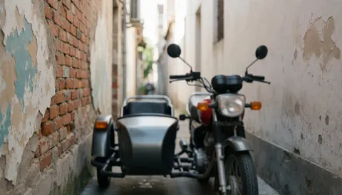 Motorcycle taxi with sidecar parked on a narrow street between brick walls with peeling paint, suitable as a text background