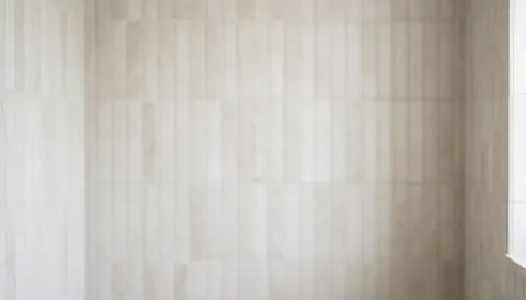Vertical ceramic tiles in a bathroom with a soft bokeh effect, ideal for commercial text overlays.
