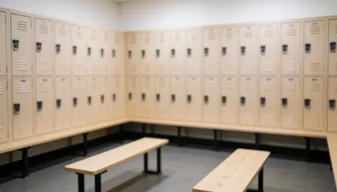 Blurred background of a locker room featuring wooden lockers and benches, providing a neutral and calm setting for martial arts instructor text overlays.