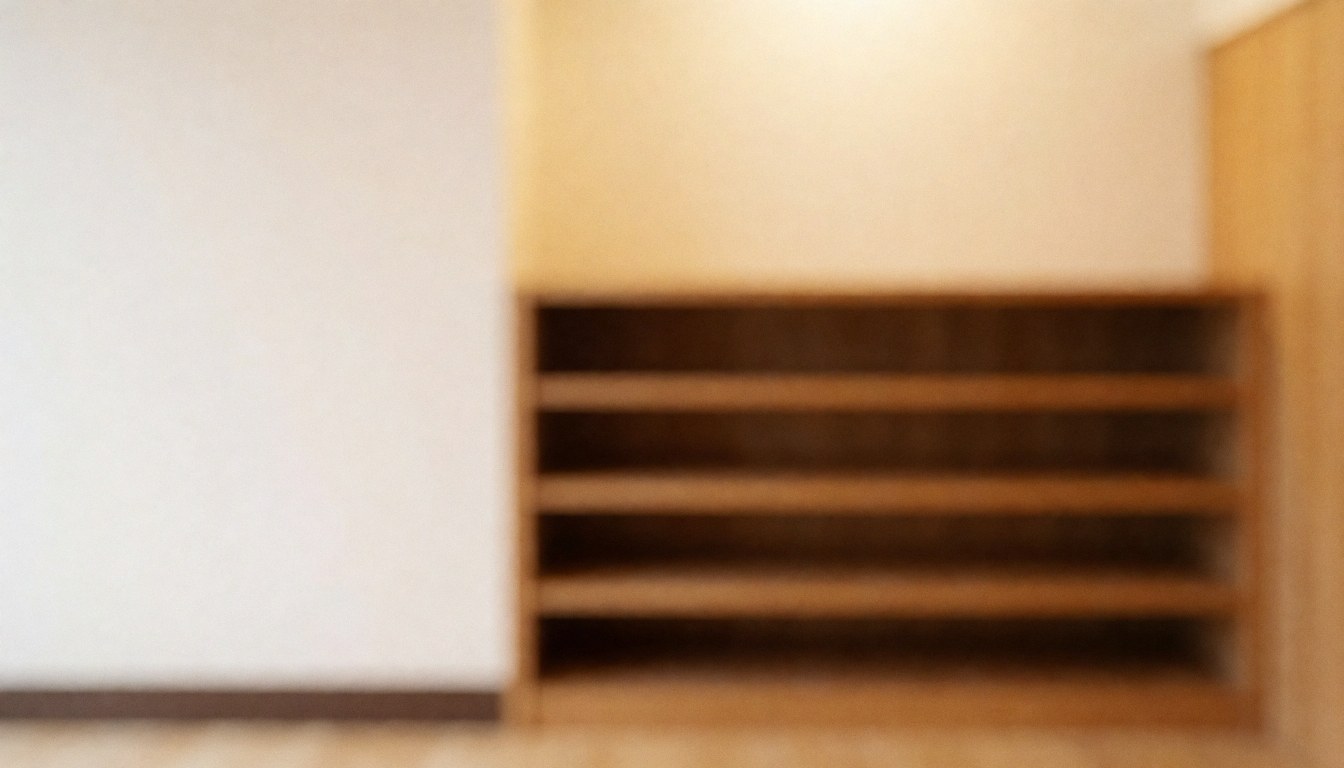 Empty wooden shelf against a white wall in a dojo, providing a warm and professional background for text overlay