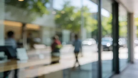 Blurred glass background with soft reflections, suitable for commercial text overlays and professional design projects.
