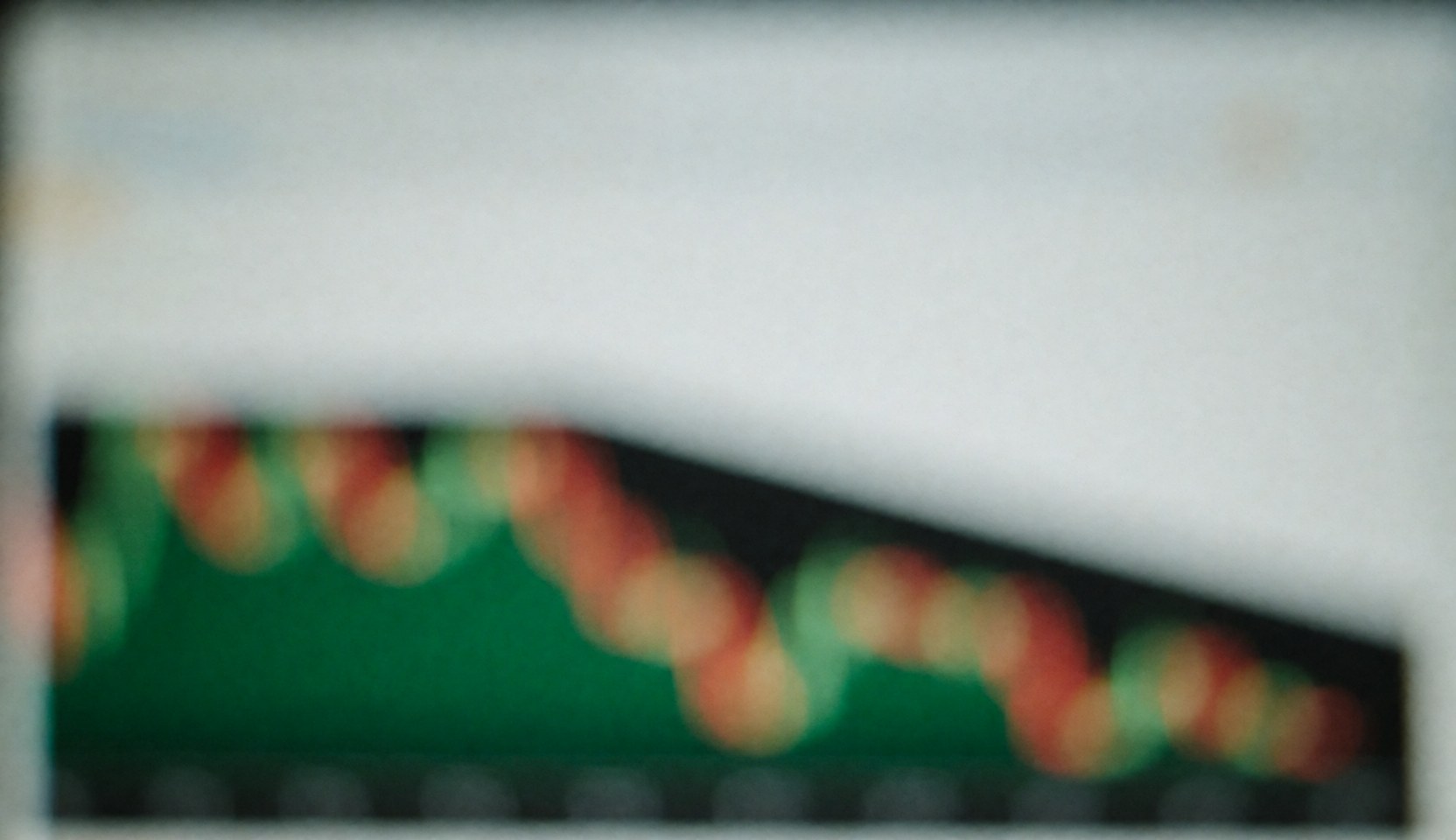 Blurred financial charts with bokeh effect on screen, serving as a background for finance and banking text.
