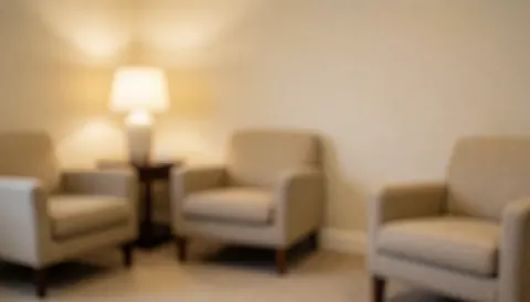 Beige waiting chairs and lamp against light walls for manicure and pedicure salon text overlay