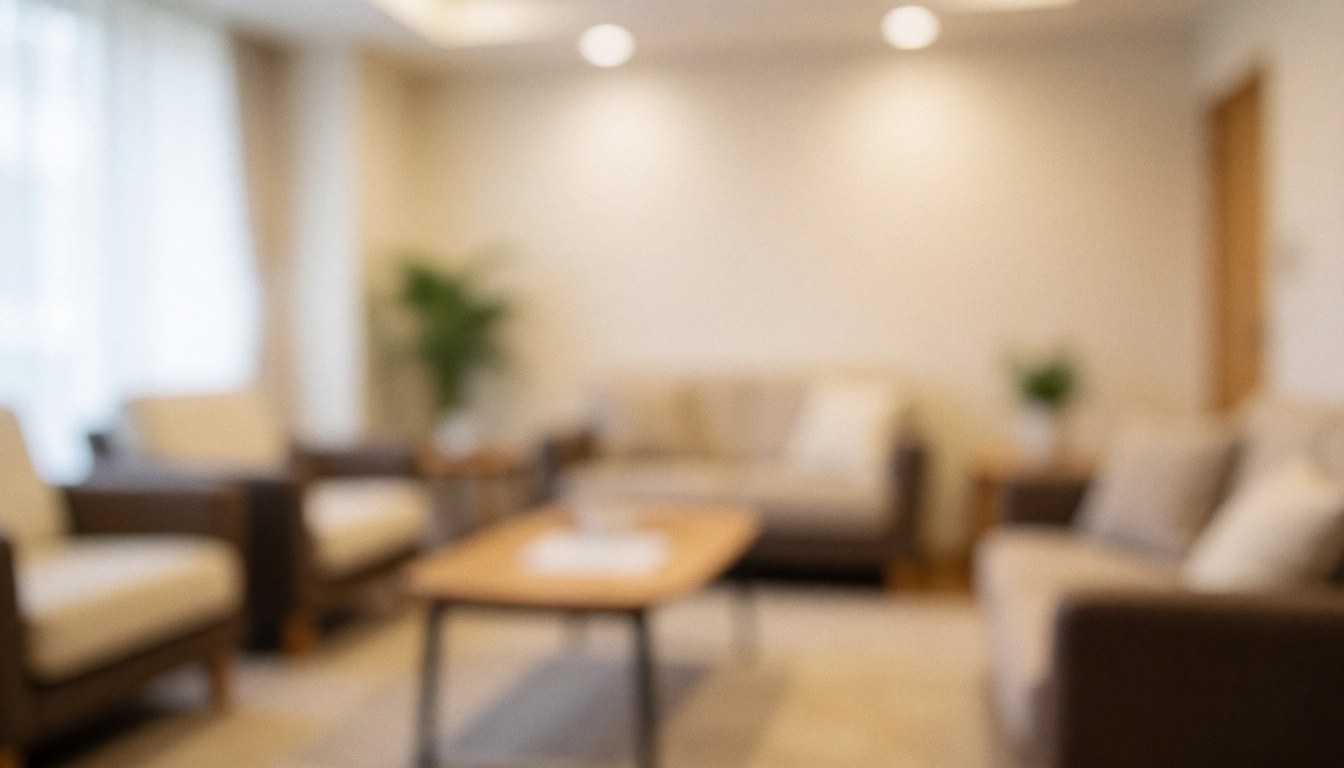 Soft focus background of a cozy waiting area with comfortable seating and warm lighting, suitable for dance school text overlays