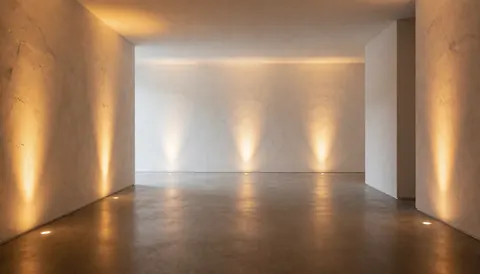 Modern corporate lobby featuring textured walls, warm lighting, and polished floors suitable for elegant events