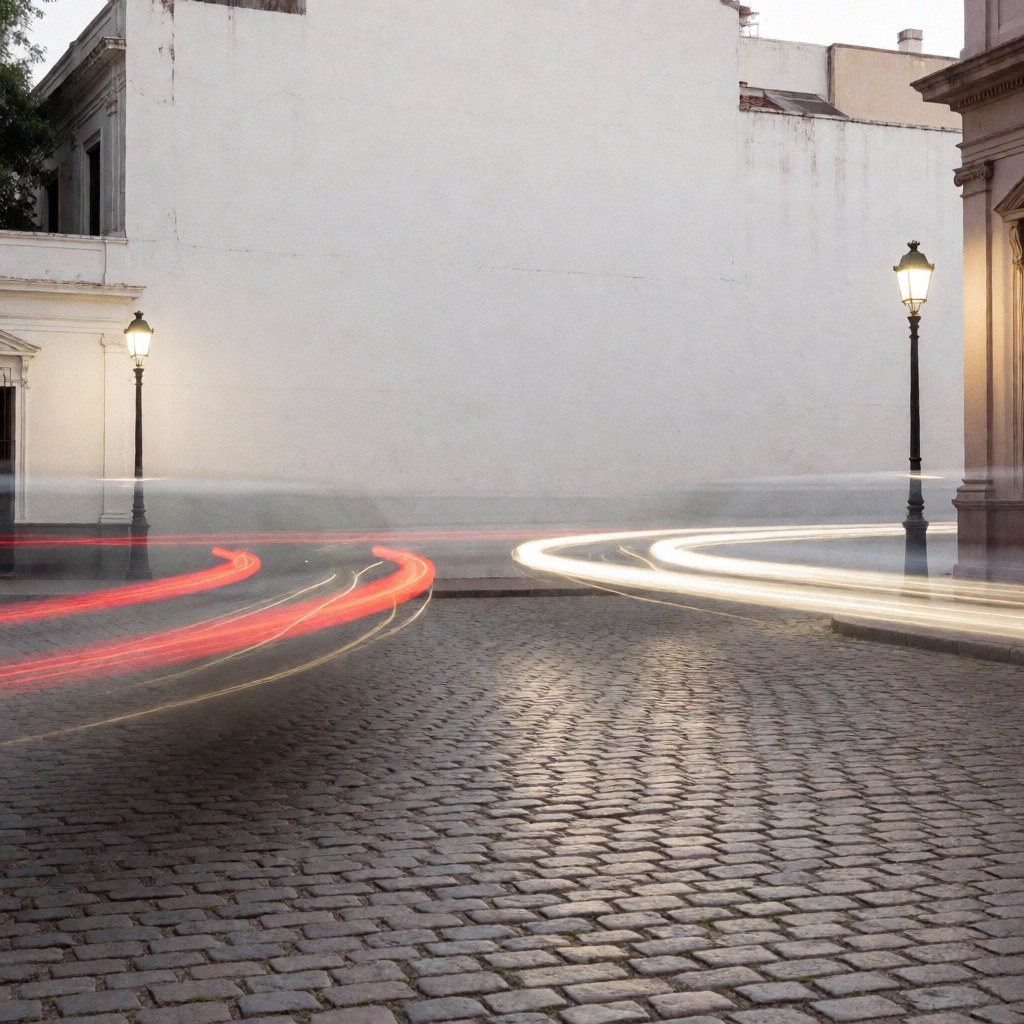 Long exposure light trails from cars and streetlamps on a historic cobblestone plaza at night