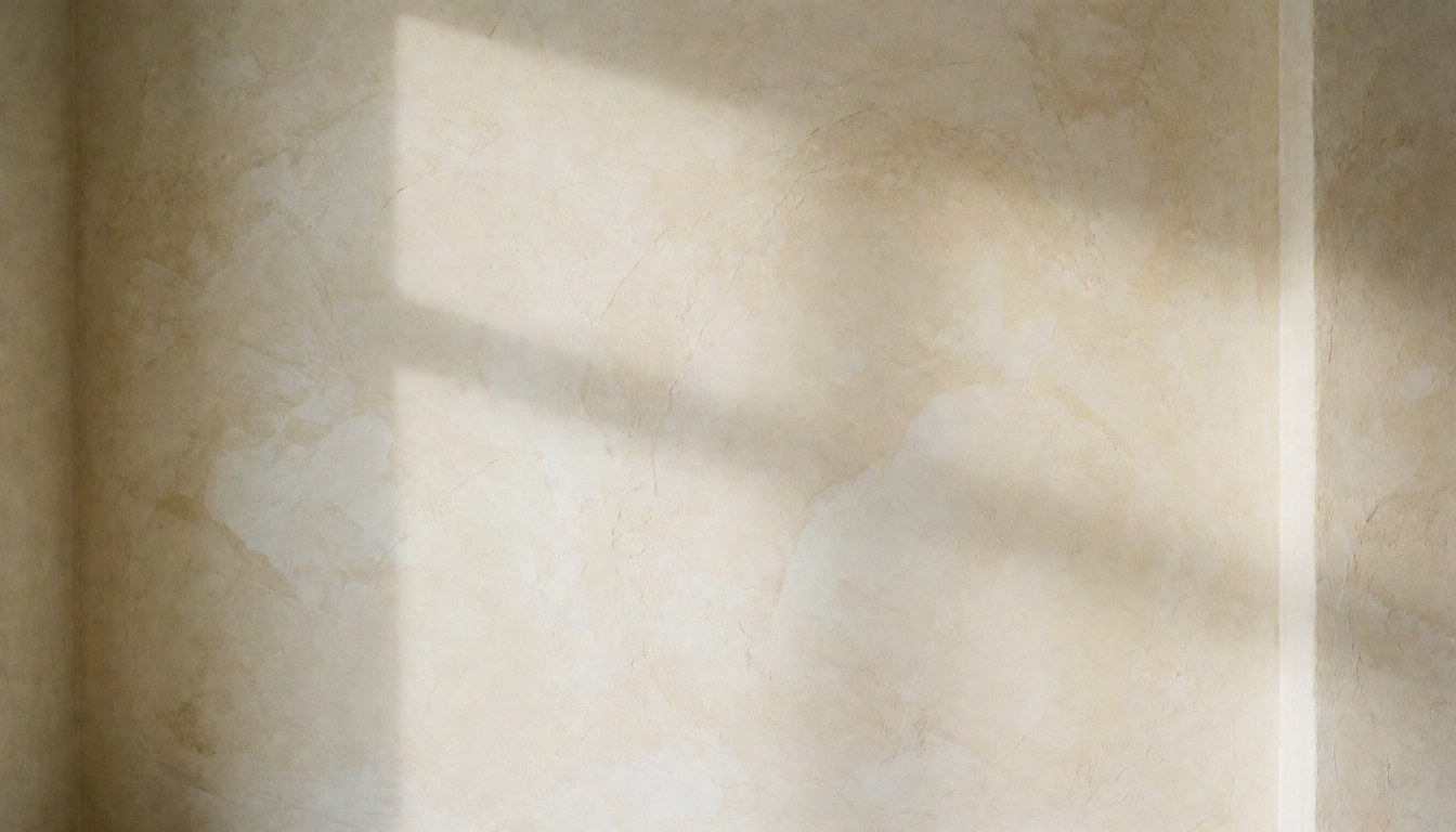 Soft cream textured wall with diffused light and window shadow, ideal background for text in cafes or decorative spaces.