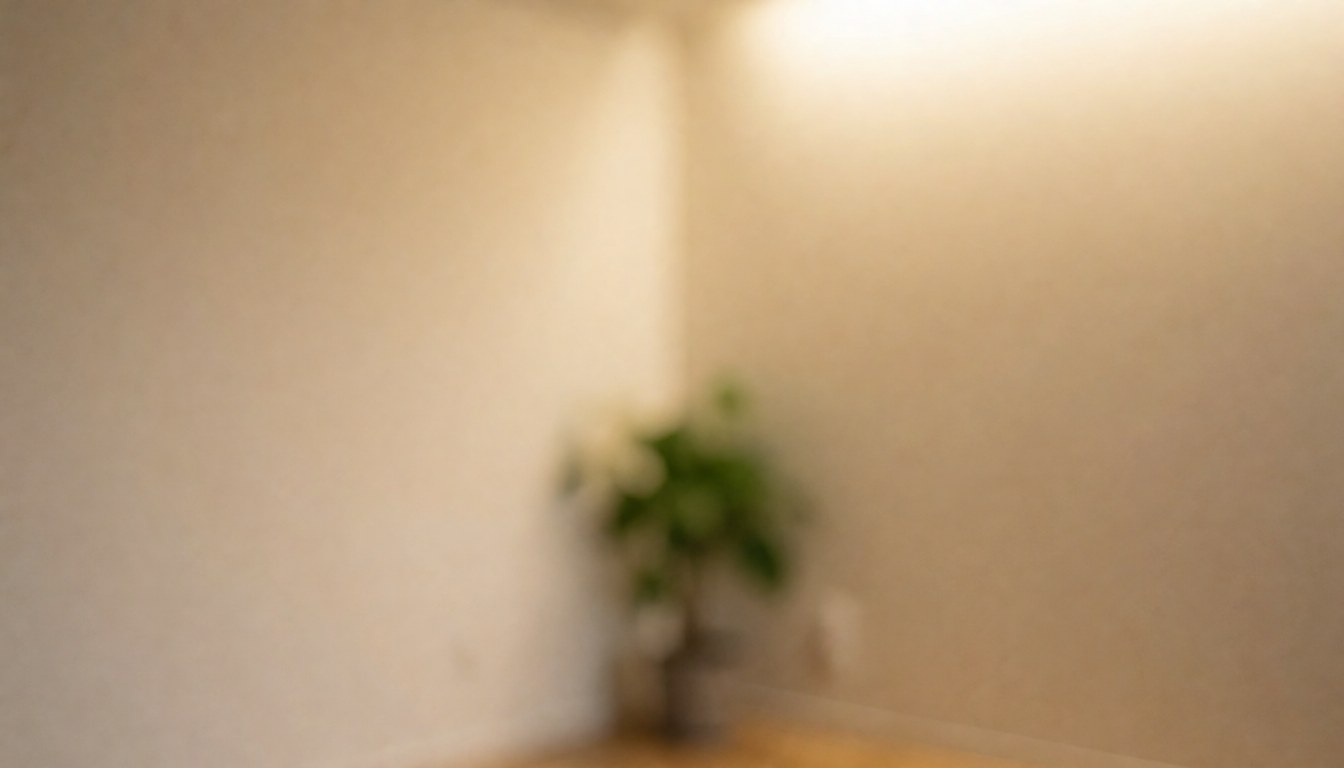 Beige wall yoga studio corner featuring a green plant and warm ambient lighting, creating a calm atmosphere suitable for text overlays.