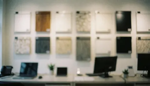 A collection of window samples mounted on a wall in a showroom setting, providing a professional background for text overlays related to window installation services.