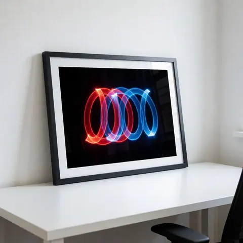 Red and blue light trails displayed in a black frame on a white table, suitable for kinetic photography studios.