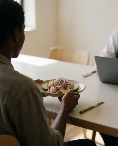 A happy customer enjoying fresh ceviche in a bright restaurant with light walls and natural lighting, representing a positive dining experience for cooking classes.