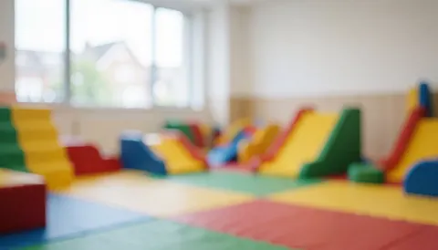 A playground background with soft colors and toys, ideal for text about safe spaces for toddlers